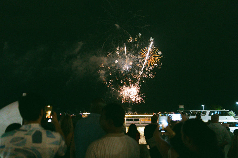 A Chicago Water Taxi Fireworks Cruise viewing the Navy Pier fireworks display from the Chicago River