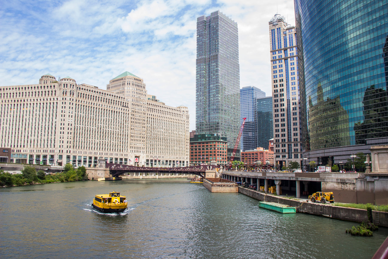 Chicago Water Taxi boat on the Chicago River with the downtown skyline
