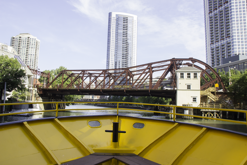 A yellow boat's perspective of the Chicago River and a steel bridge during the 2013 route expansion.
