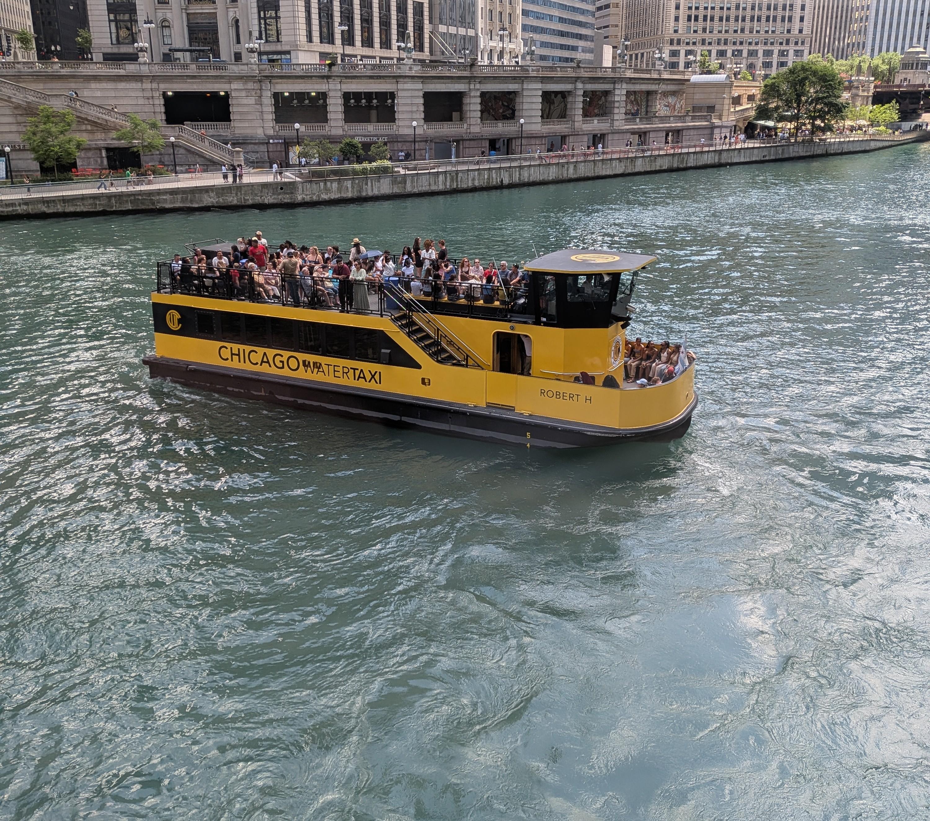 The Robert H, a modern double-decker Chicago Water Taxi, carrying passengers on the Chicago River in 2020.